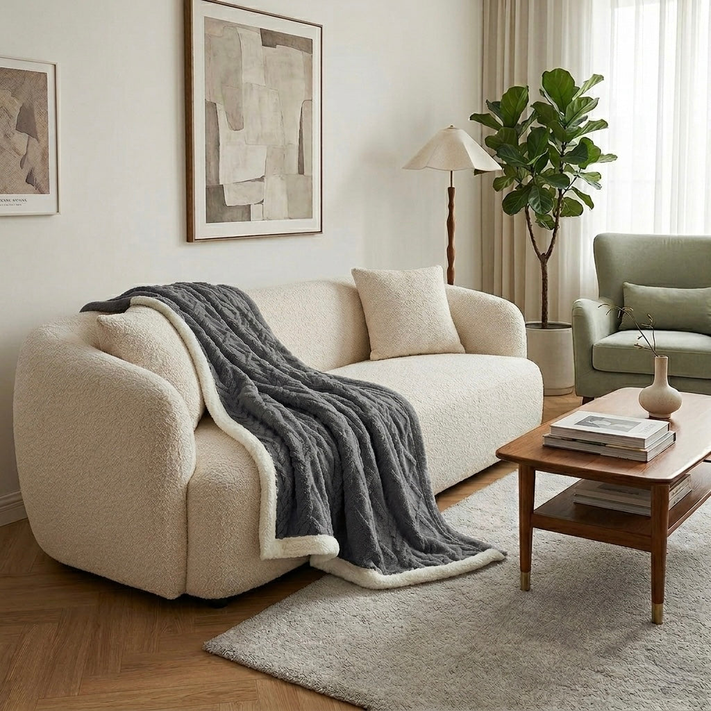 Grey sherpa weighted blanket on sofa with indoor plant modern home Australia