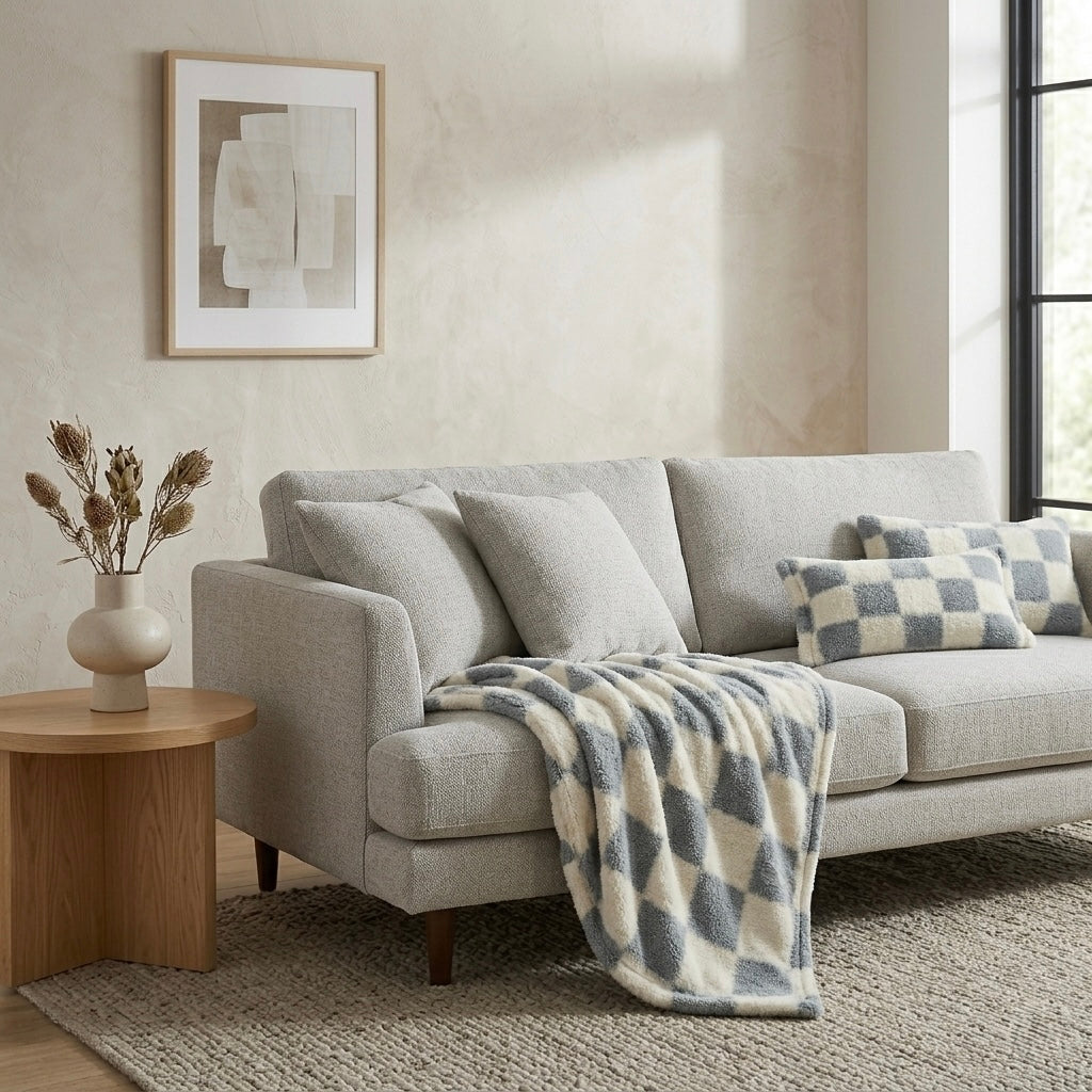 Blue nordic checkerboard throw draped over sofa modern Australian living room