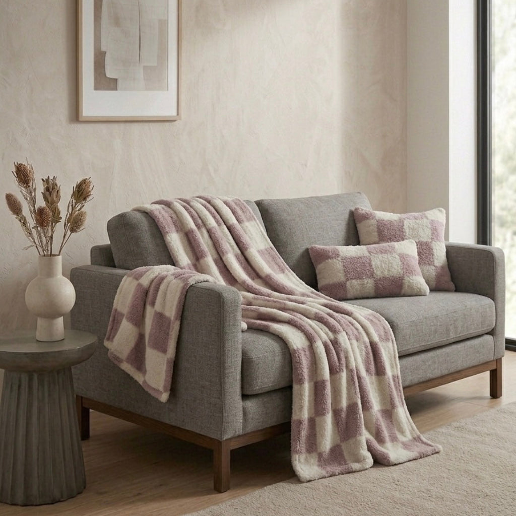 Pink nordic checkerboard throw on armchair cosy living room Australian home